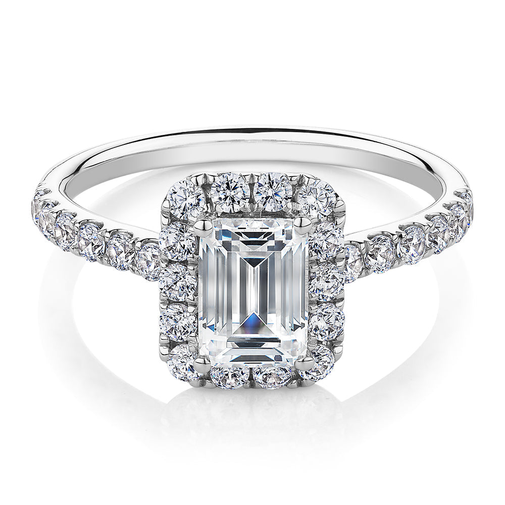 Emerald Cut and Round Brilliant halo engagement ring with 1.65 carats* of diamond simulants in 14 carat white gold