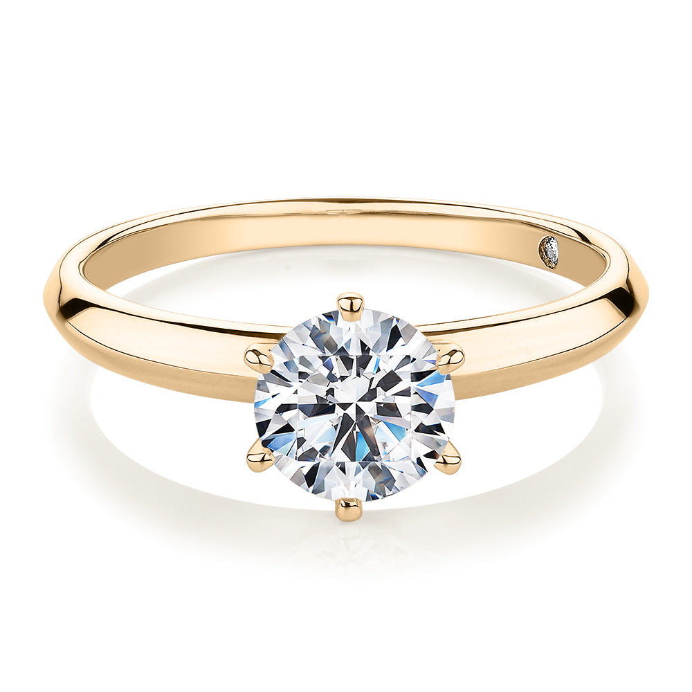 Round Brilliant solitaire engagement ring with 1 carat* diamond simulant in 10 carat yellow gold