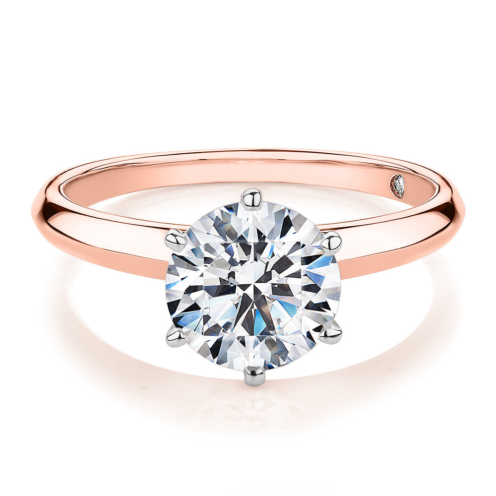 Round Brilliant solitaire engagement ring with 2 carat* diamond simulant in 14 carat rose and white gold