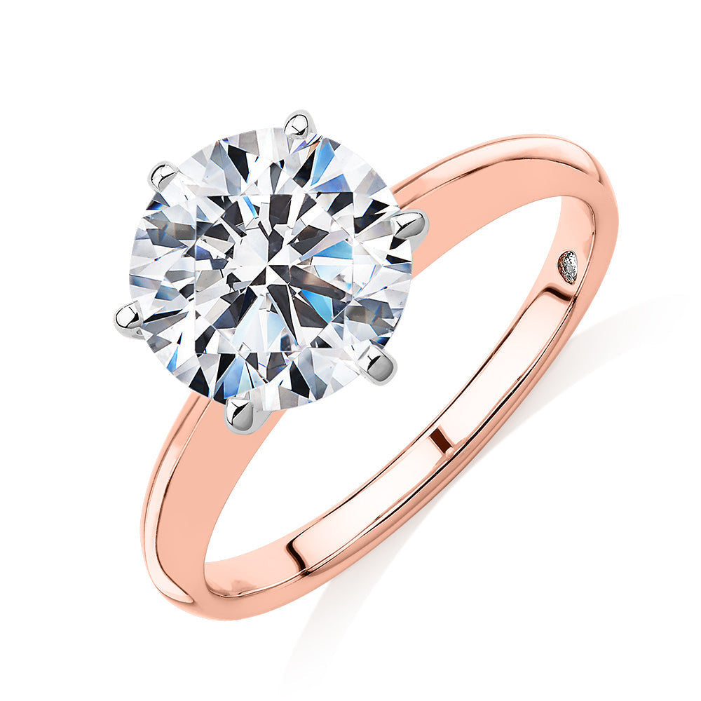 Round Brilliant solitaire engagement ring with 3 carat* diamond simulant in 14 carat rose and white gold