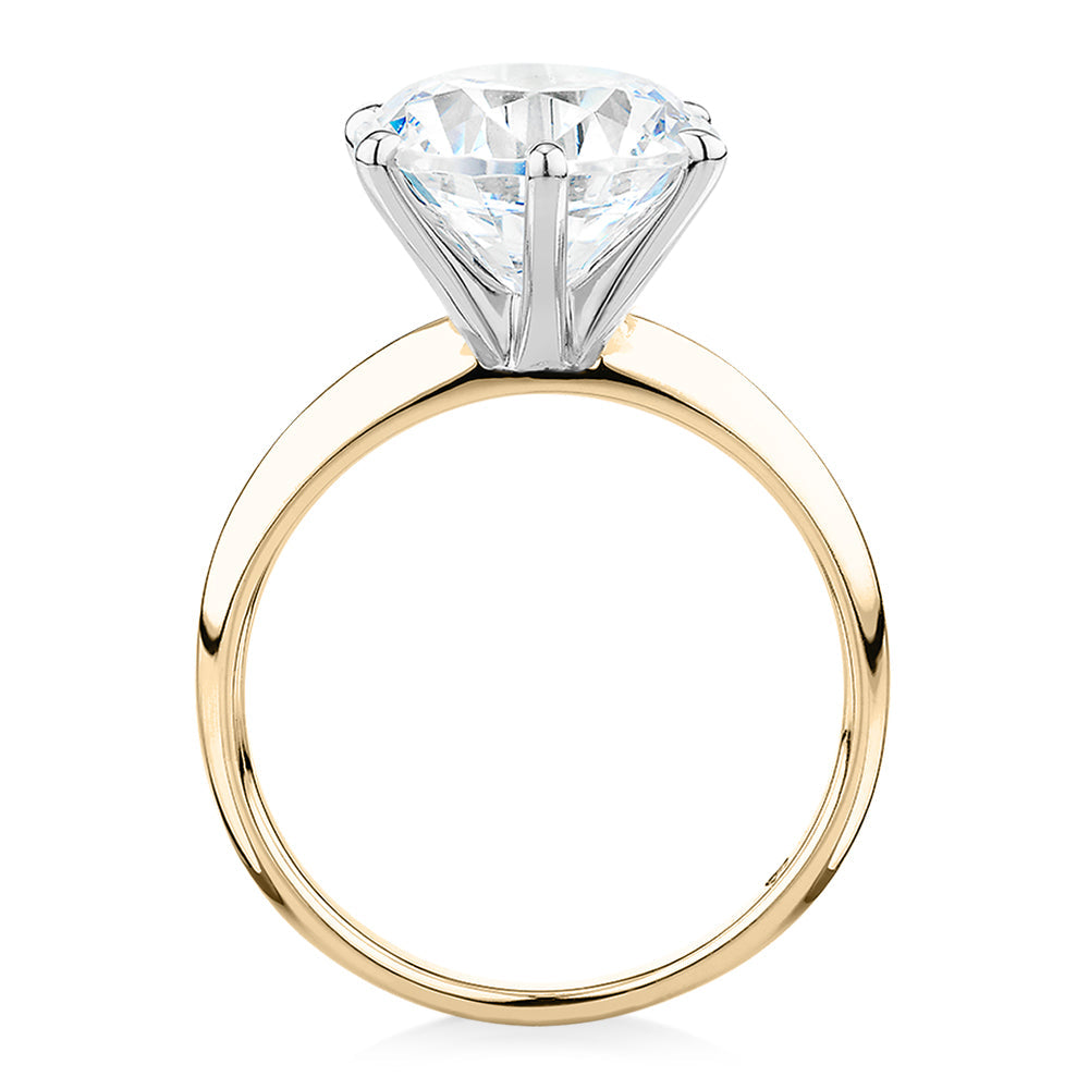 Round Brilliant solitaire engagement ring with 5.49 carat* diamond simulant in 14 carat yellow and white gold