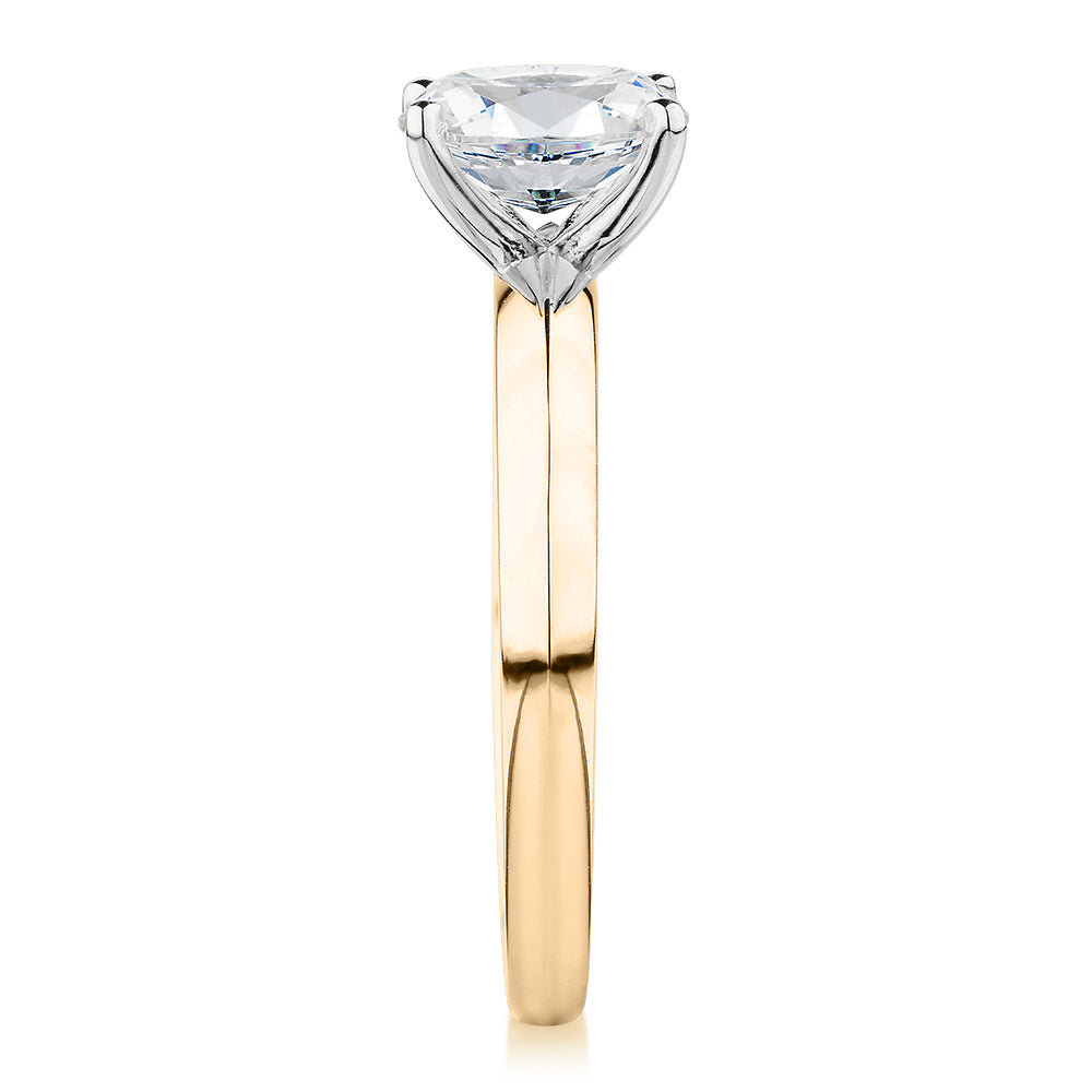 Oval solitaire engagement ring with 1.21 carat* diamond simulant in 14 carat yellow and white gold