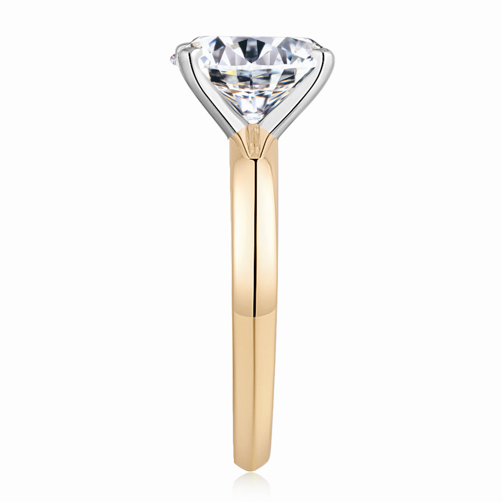 Oval solitaire engagement ring with 2.54 carat* diamond simulant in 10 carat yellow and white gold