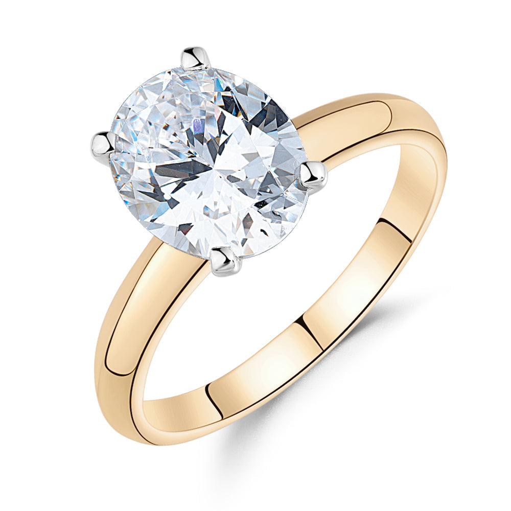 Oval solitaire engagement ring with 2.54 carat* diamond simulant in 10 carat yellow and white gold