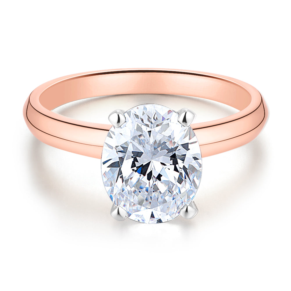Oval solitaire engagement ring with 2.54 carat* diamond simulant in 14 carat rose and white gold