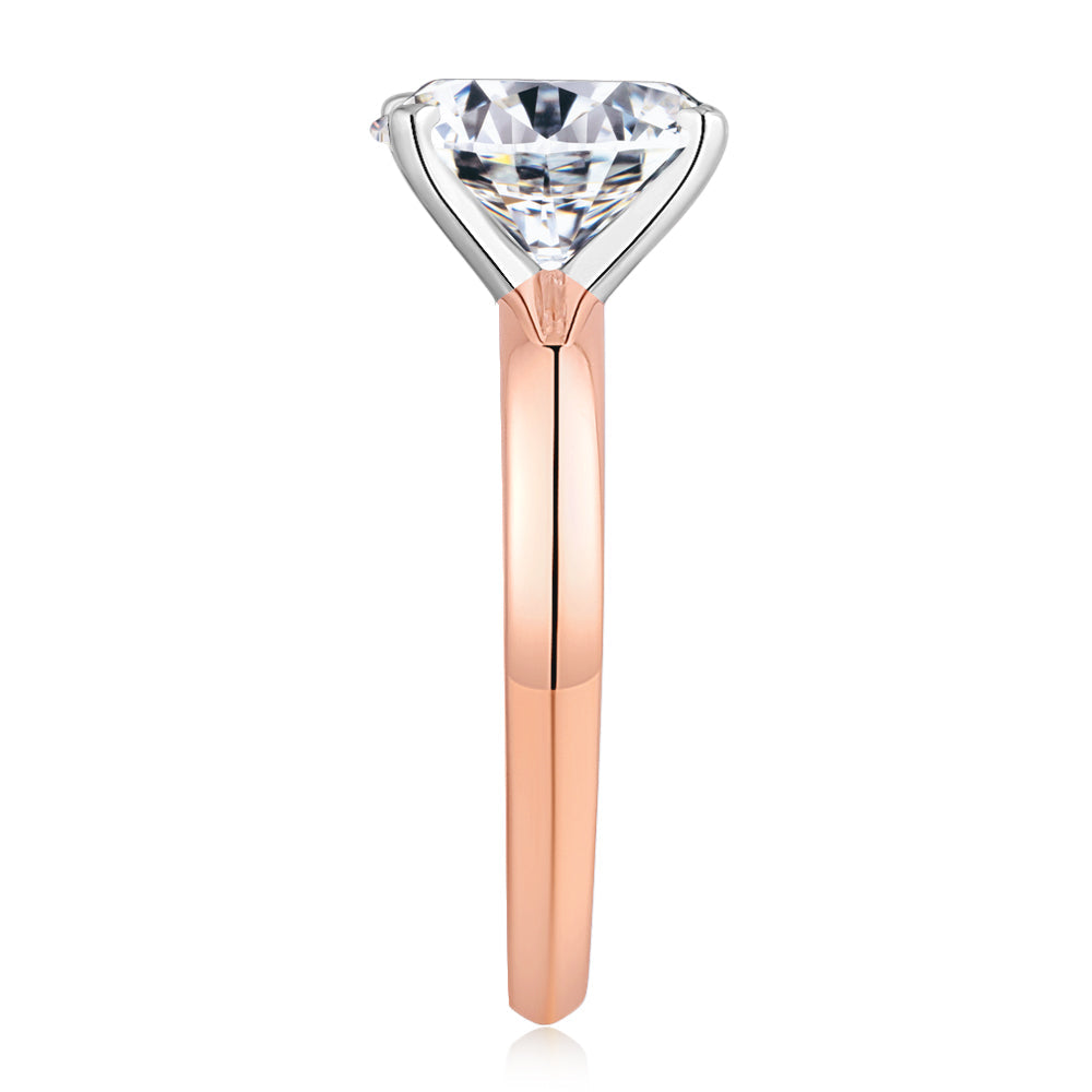 Oval solitaire engagement ring with 2.54 carat* diamond simulant in 14 carat rose and white gold