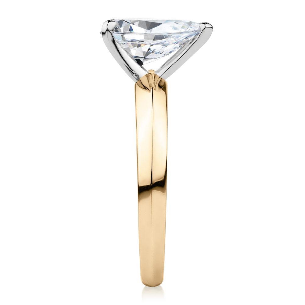 Pear solitaire engagement ring with 1.8 carat* diamond simulant in 10 carat yellow and white gold