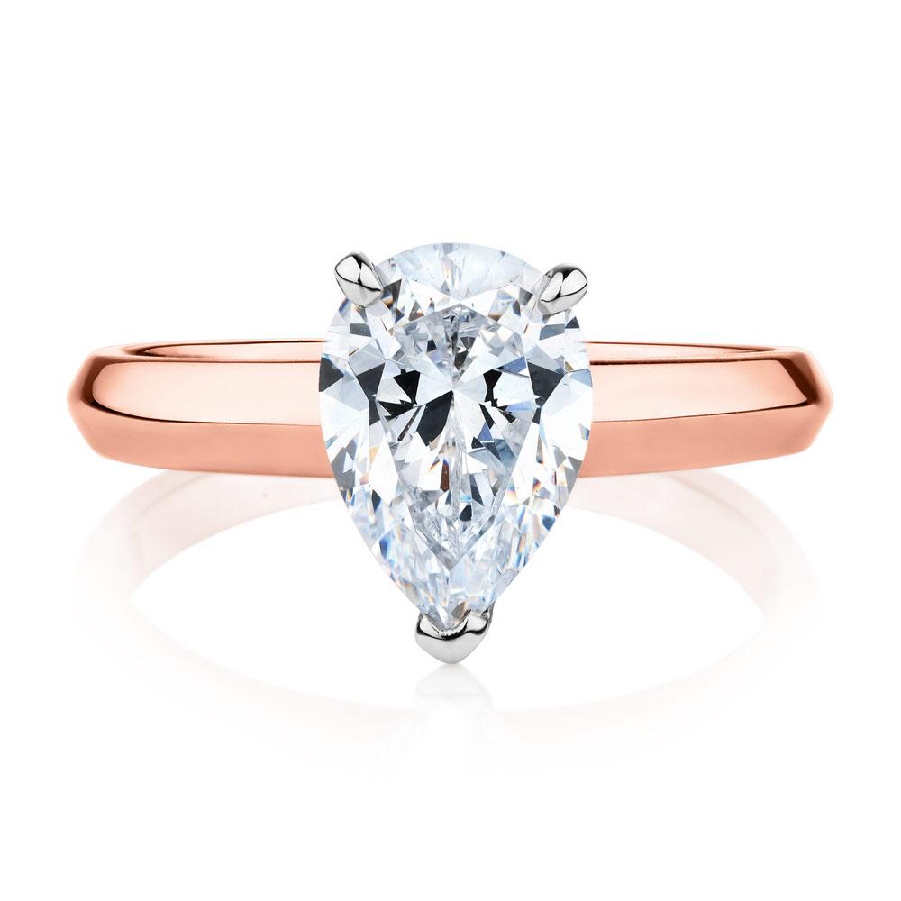 Pear solitaire engagement ring with 1.8 carat* diamond simulant in 10 carat rose and white gold