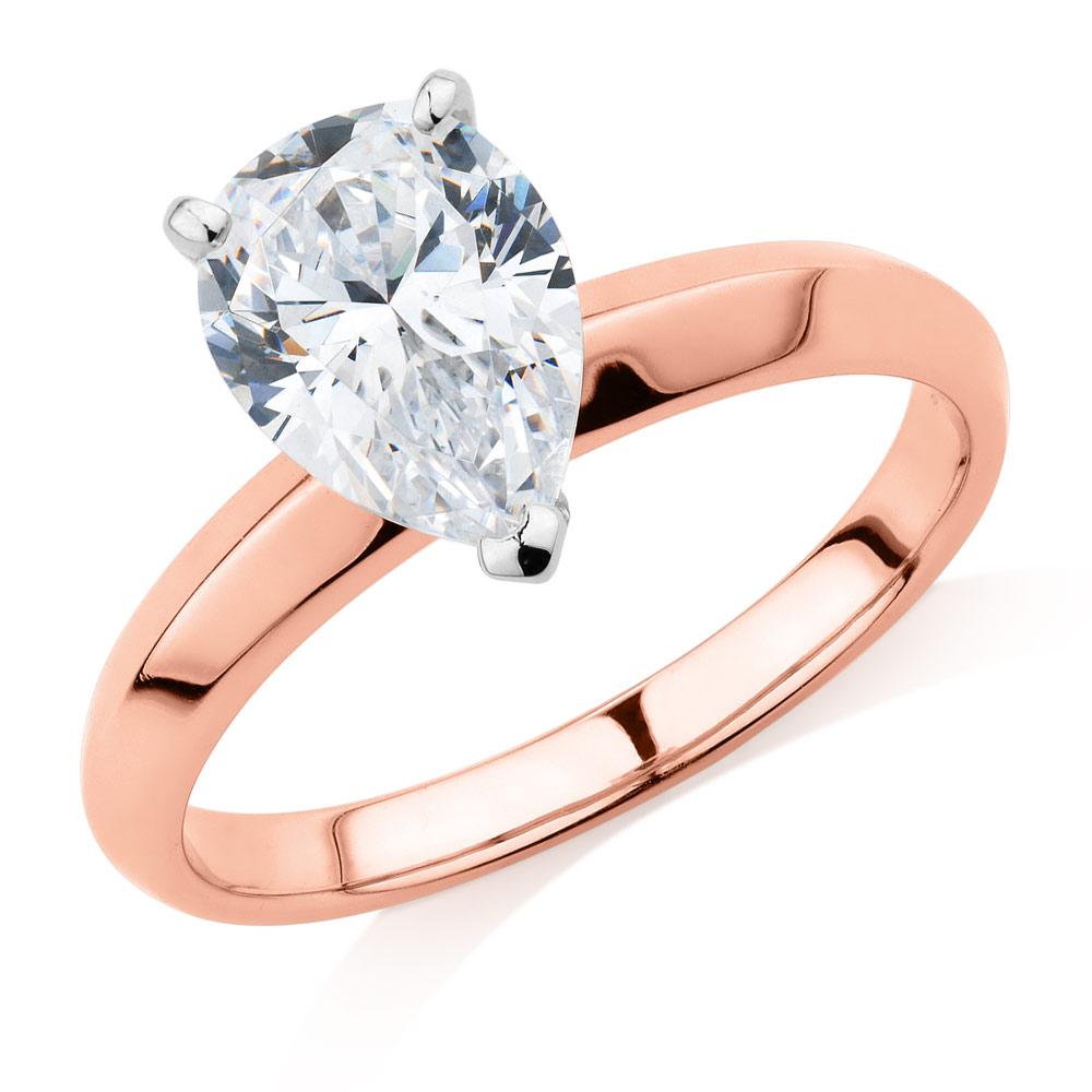 Pear solitaire engagement ring with 1.8 carat* diamond simulant in 10 carat rose and white gold