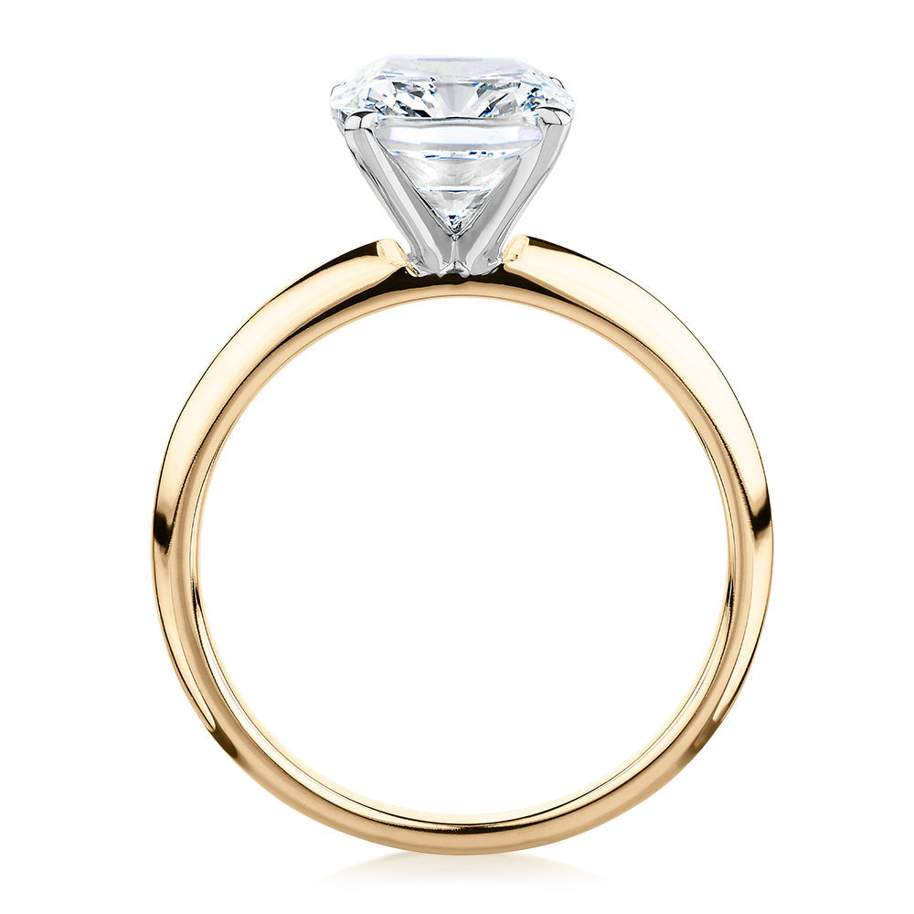 Cushion Radiant solitaire engagement ring with 3.00 carat* diamond simulant in 10 carat yellow and white gold