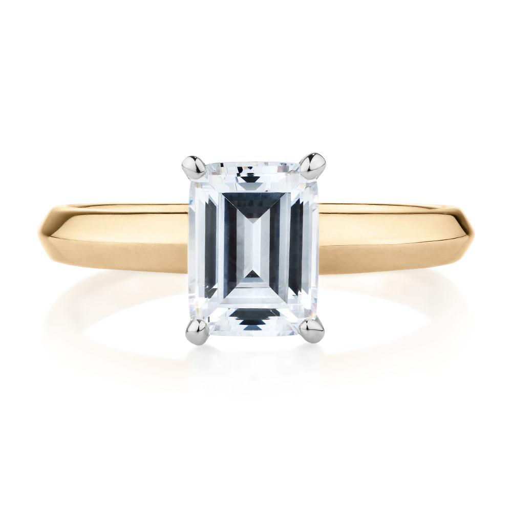Emerald Cut solitaire engagement ring with 2.17 carat* diamond simulant in 10 carat yellow and white gold