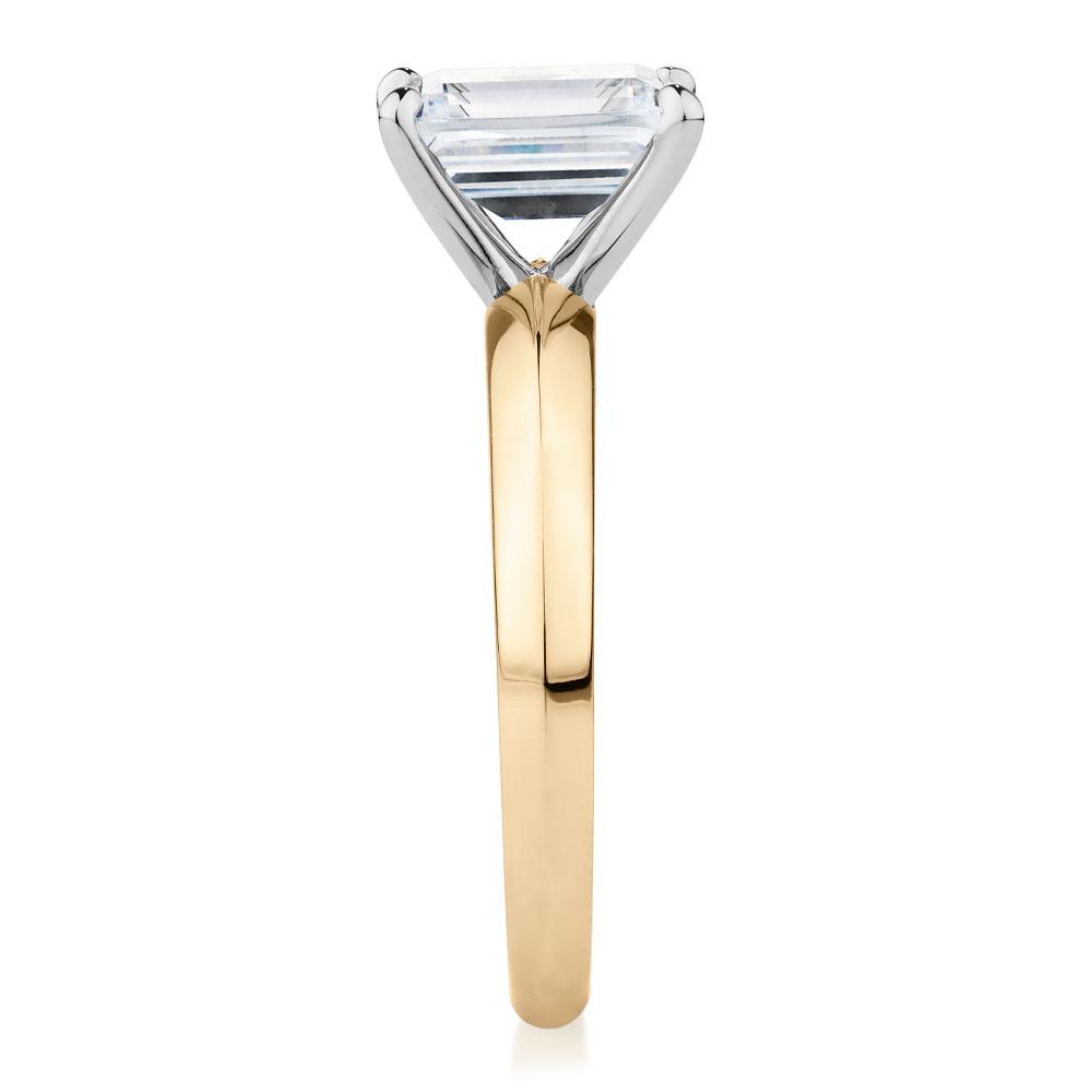 Emerald Cut solitaire engagement ring with 2.17 carat* diamond simulant in 10 carat yellow and white gold