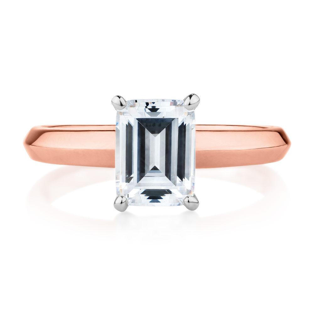 Emerald Cut solitaire engagement ring with 2.17 carat* diamond simulant in 10 carat rose and white gold