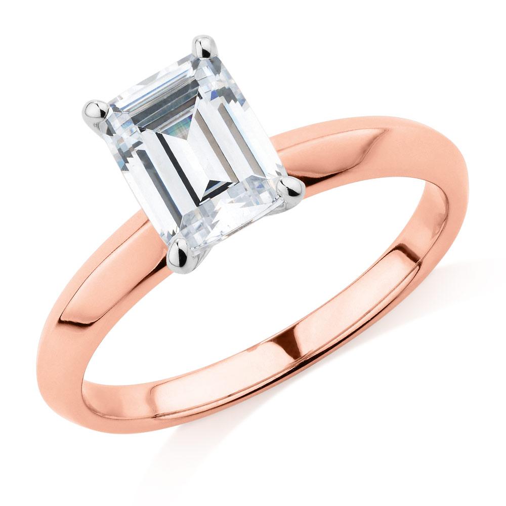 Emerald Cut solitaire engagement ring with 2.17 carat* diamond simulant in 10 carat rose and white gold