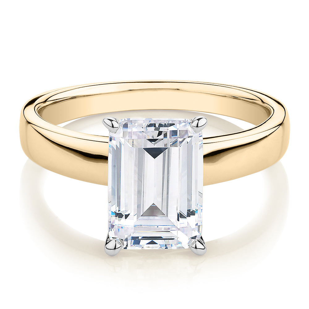 Emerald Cut solitaire engagement ring with 3.01 carat* diamond simulant in 10 carat yellow and white gold