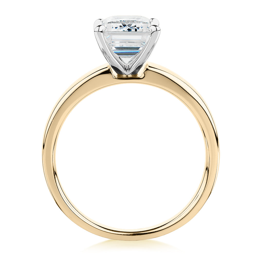 Emerald Cut solitaire engagement ring with 3.01 carat* diamond simulant in 10 carat yellow and white gold