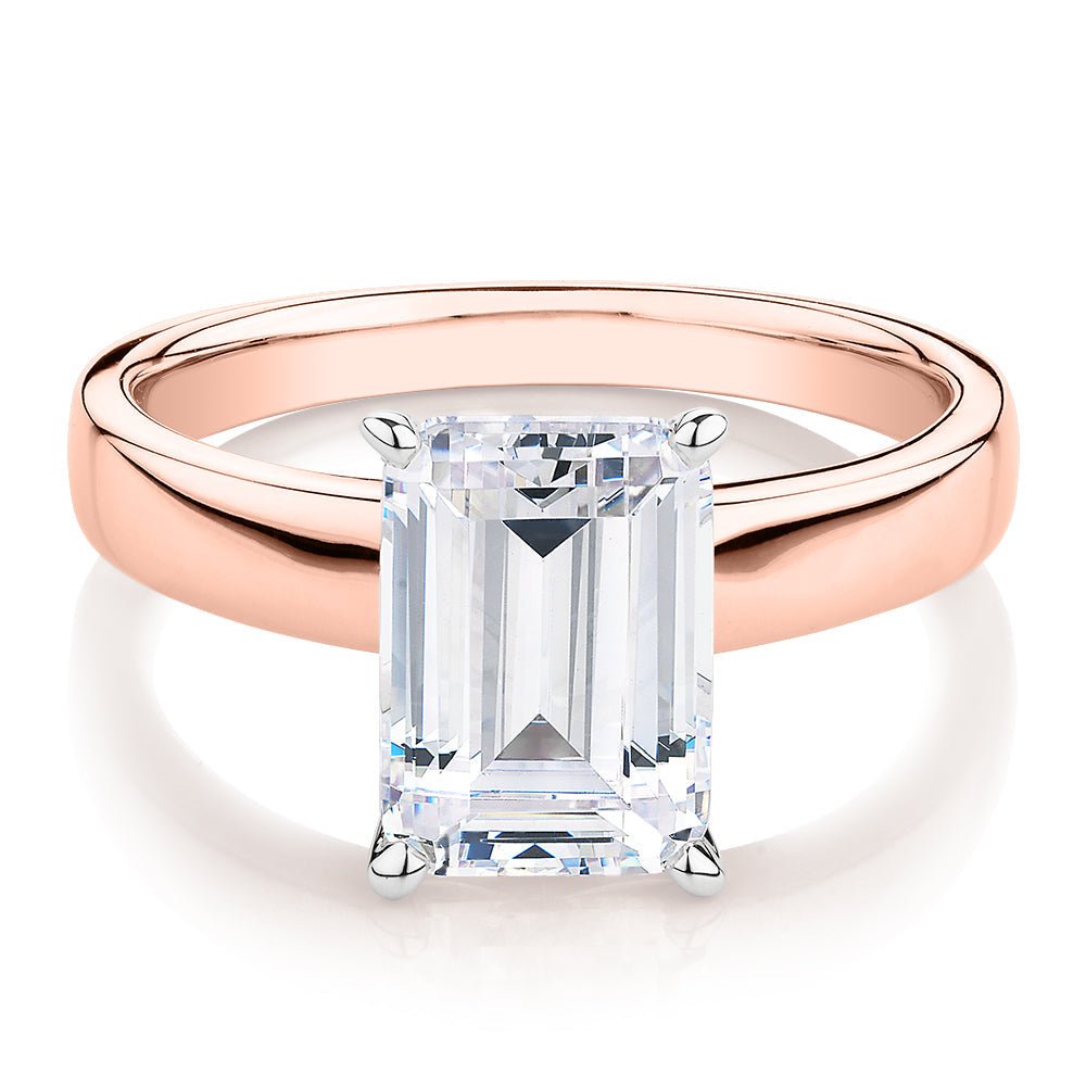 Emerald Cut solitaire engagement ring with 3.01 carat* diamond simulant in 10 carat rose and white gold