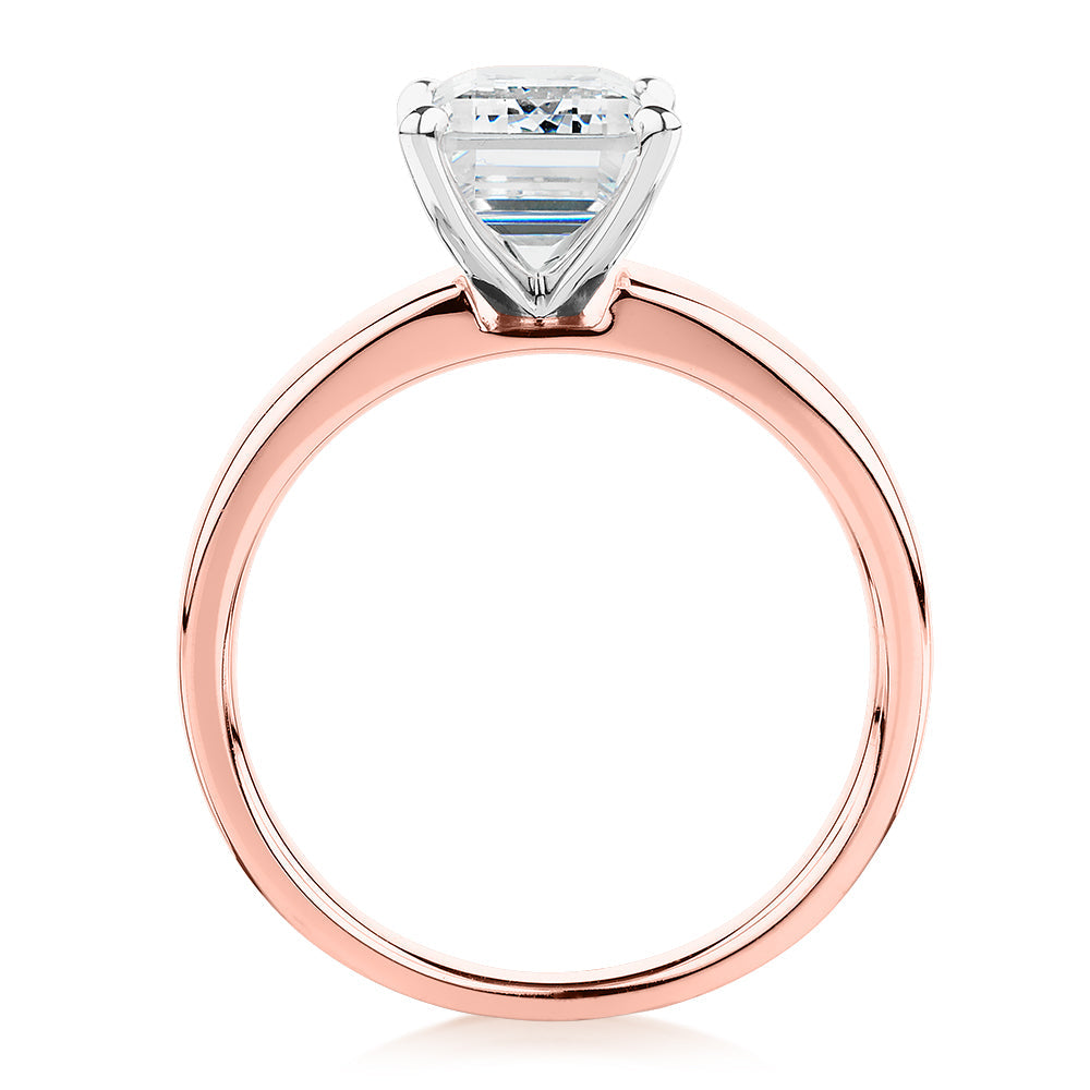 Emerald Cut solitaire engagement ring with 3.01 carat* diamond simulant in 10 carat rose and white gold