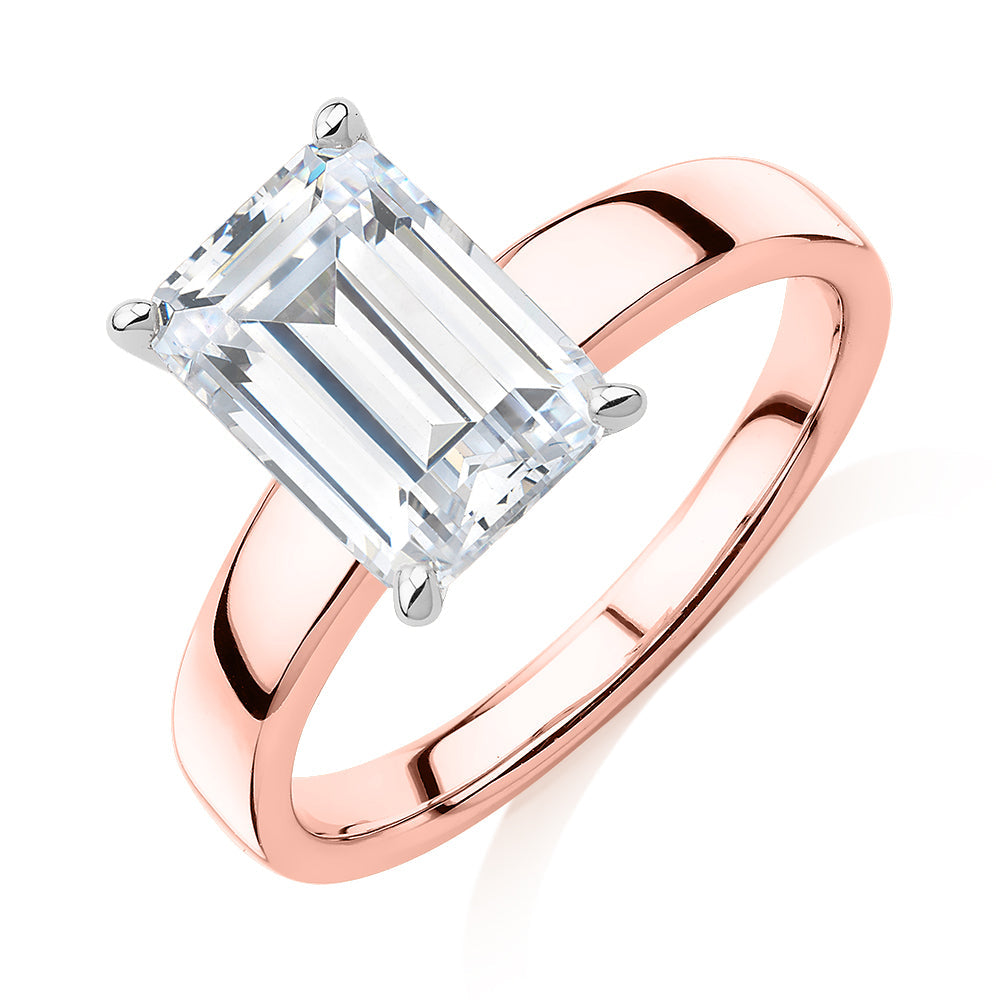 Emerald Cut solitaire engagement ring with 3.01 carat* diamond simulant in 10 carat rose and white gold