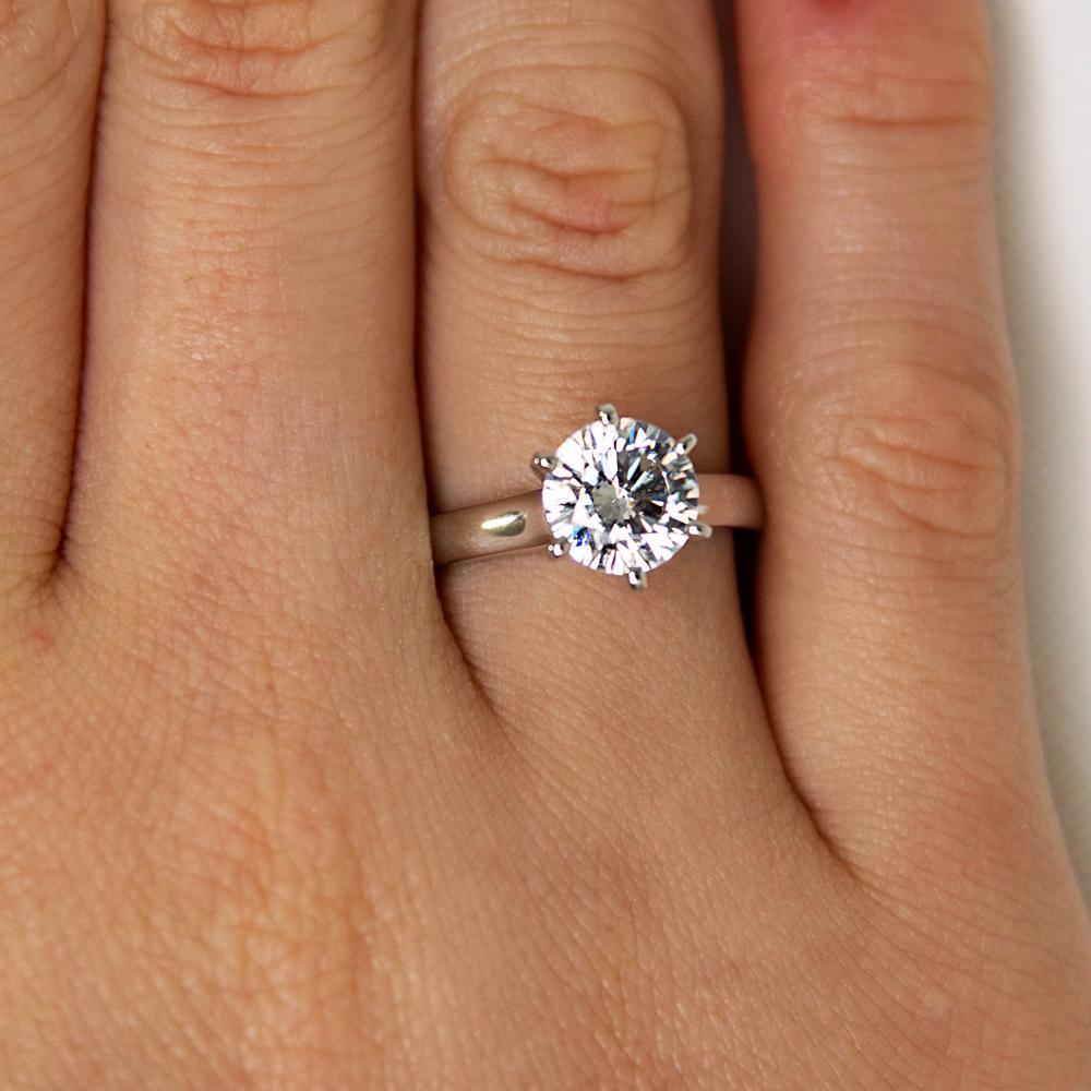 Round Brilliant solitaire engagement ring with 2 carat* diamond simulant in 10 carat white gold