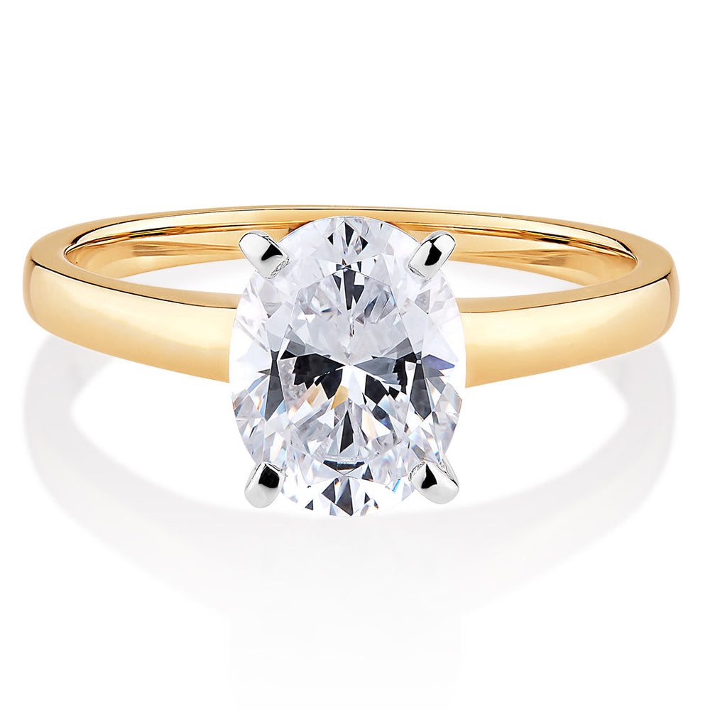 Oval solitaire engagement ring with 2 carat* diamond simulant in 14 carat yellow and white gold