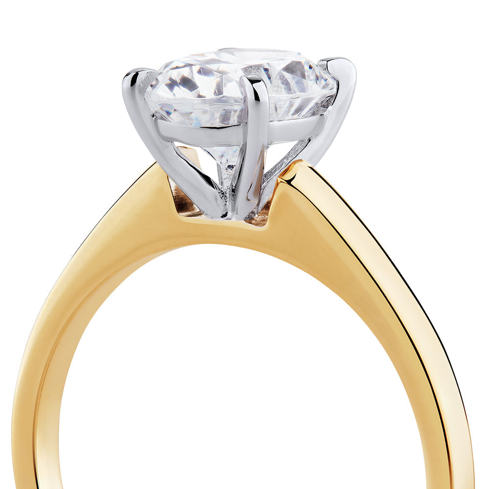 Oval solitaire engagement ring with 2 carat* diamond simulant in 14 carat yellow and white gold