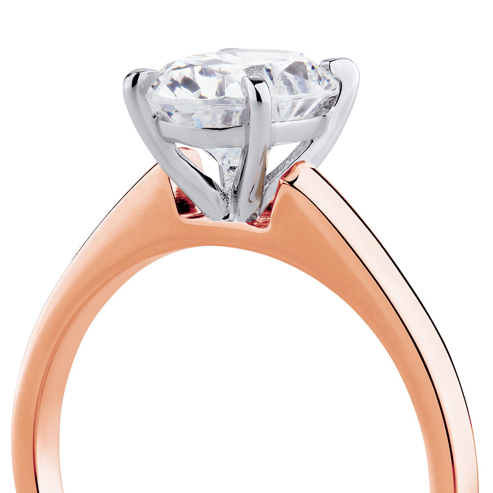 Oval solitaire engagement ring with 2 carat* diamond simulant in 14 carat rose and white gold