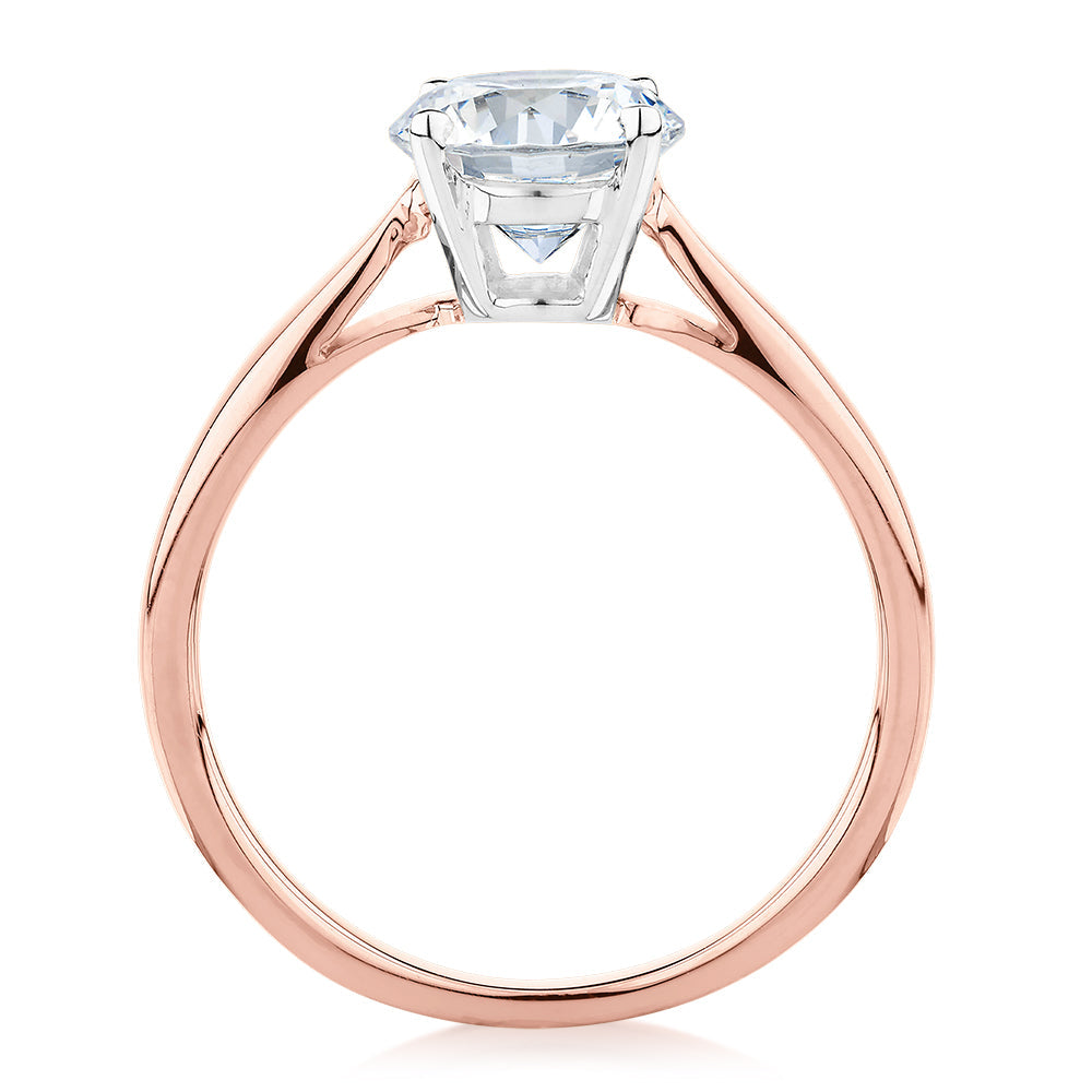 Round Brilliant solitaire engagement ring with 1.5 carat* diamond simulant in 14 carat rose and white gold