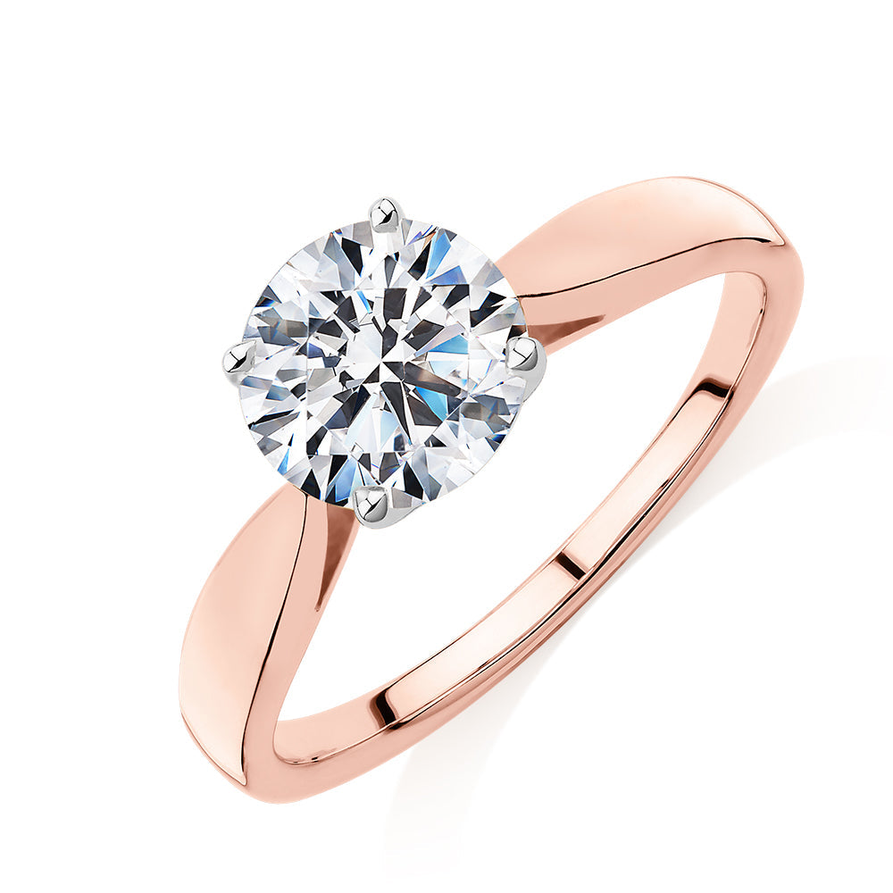 Round Brilliant solitaire engagement ring with 1.5 carat* diamond simulant in 14 carat rose and white gold