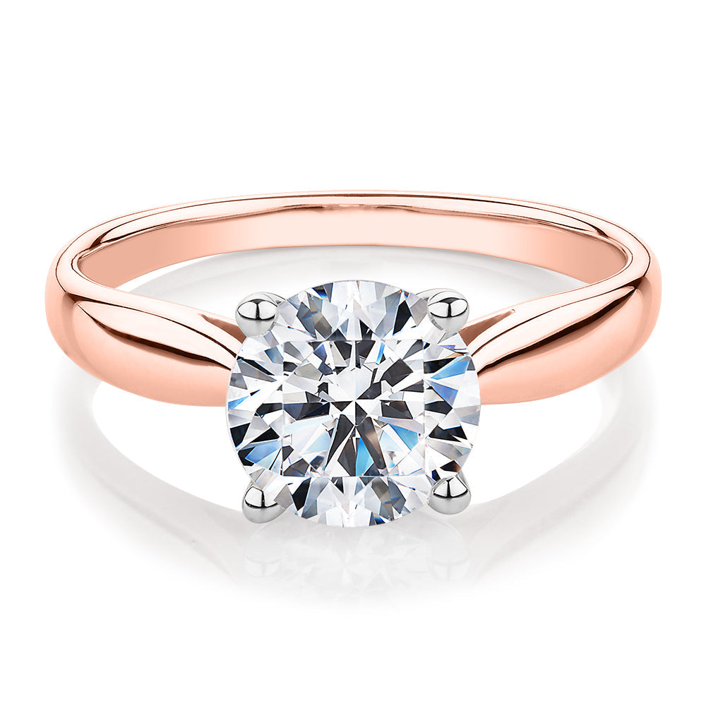 Round Brilliant solitaire engagement ring with 2 carat* diamond simulant in 14 carat rose and white gold