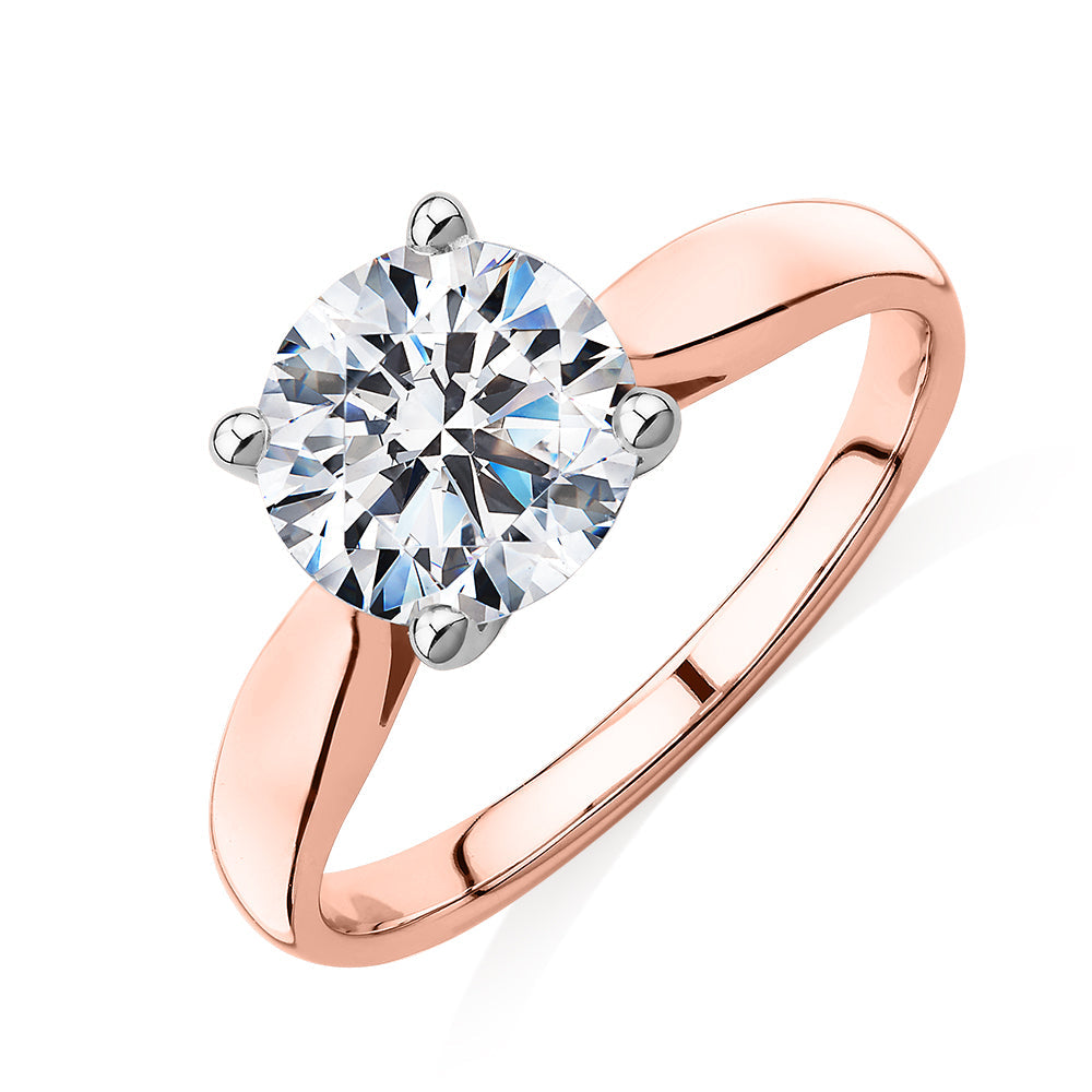 Round Brilliant solitaire engagement ring with 2 carat* diamond simulant in 14 carat rose and white gold