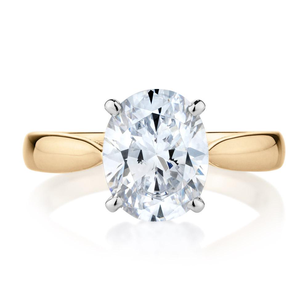 Oval solitaire engagement ring with 2.54 carat* diamond simulant in 10 carat yellow and white gold