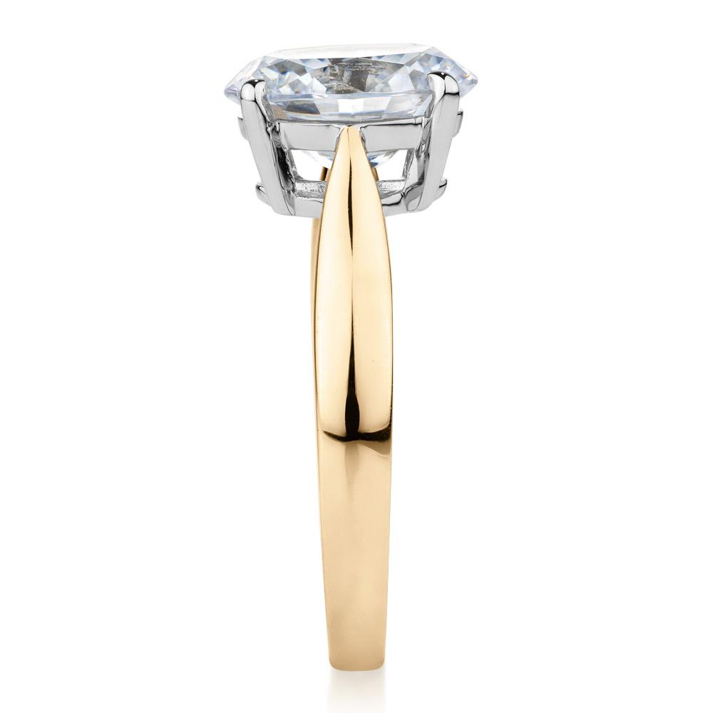 Oval solitaire engagement ring with 2.54 carat* diamond simulant in 10 carat yellow and white gold
