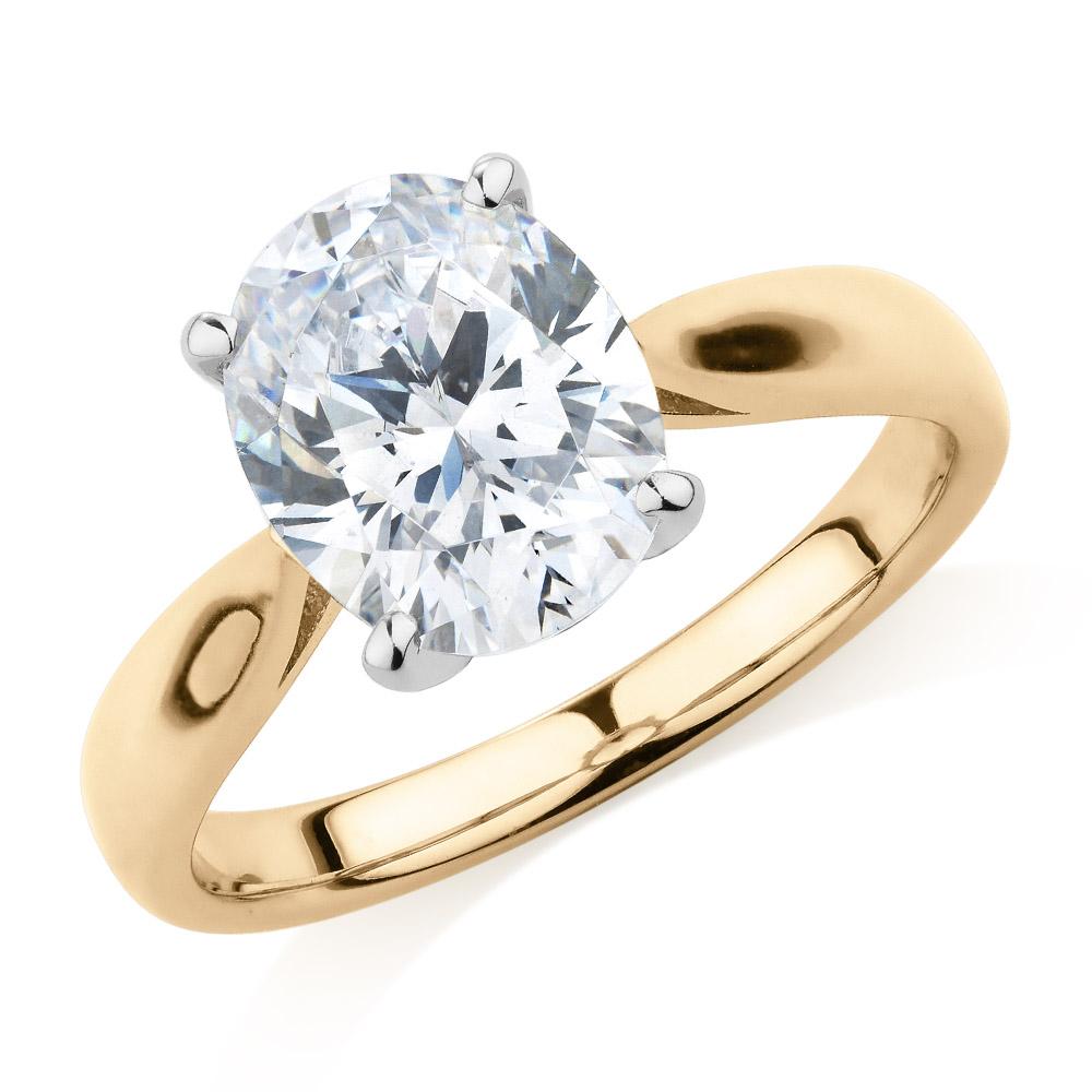 Oval solitaire engagement ring with 2.54 carat* diamond simulant in 10 carat yellow and white gold