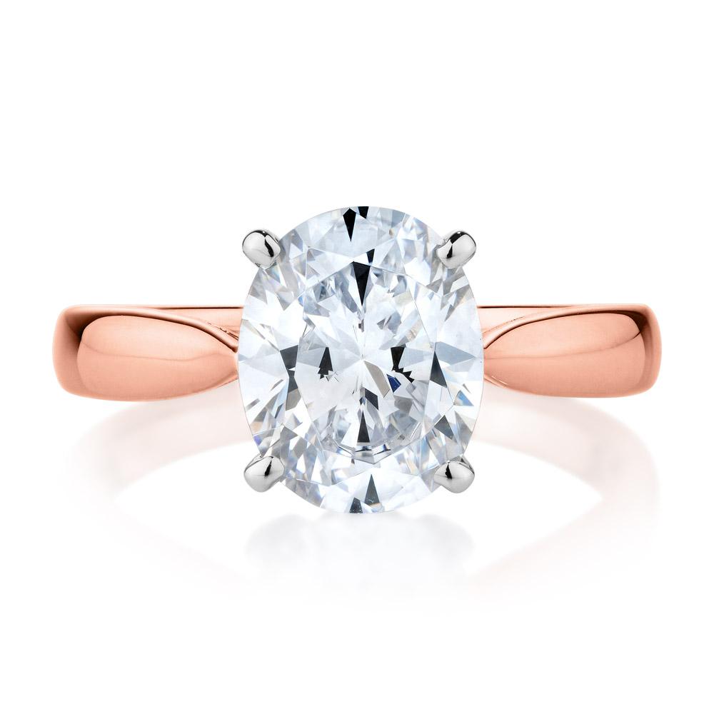 Oval solitaire engagement ring with 2.54 carat* diamond simulant in 10 carat rose and white gold
