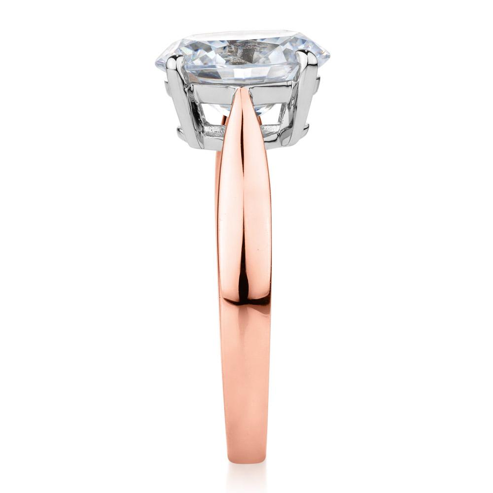 Oval solitaire engagement ring with 2.54 carat* diamond simulant in 10 carat rose and white gold