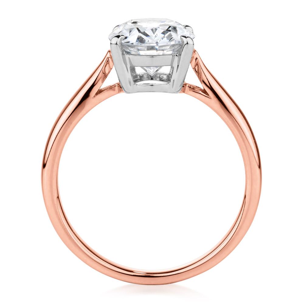 Oval solitaire engagement ring with 2.54 carat* diamond simulant in 10 carat rose and white gold