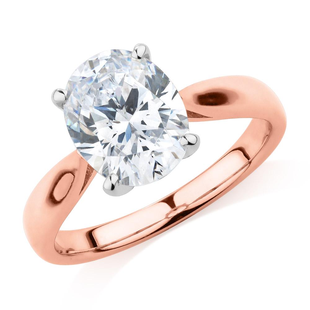 Oval solitaire engagement ring with 2.54 carat* diamond simulant in 10 carat rose and white gold