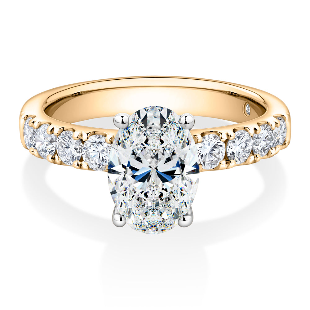 Lab-Grown Simulant, 2.62 carat*TW oval and round brilliant shouldered solitaire engagement ring in 10 carat yellow and white gold