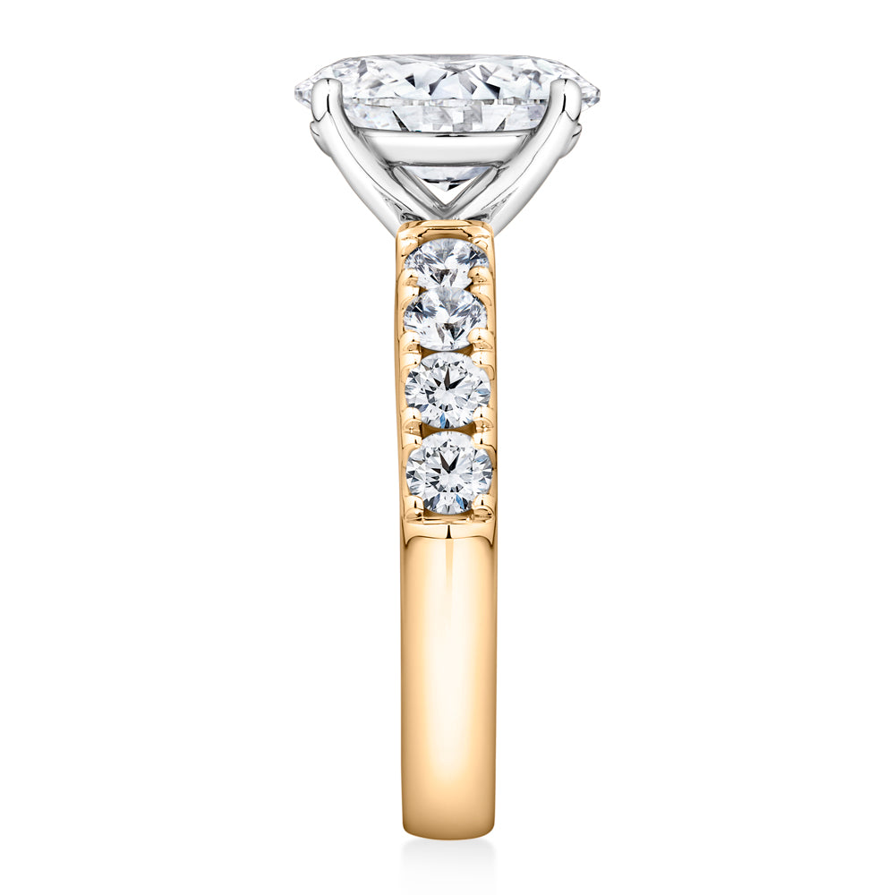 Lab-Grown Simulant, 2.62 carat*TW oval and round brilliant shouldered solitaire engagement ring in 10 carat yellow and white gold