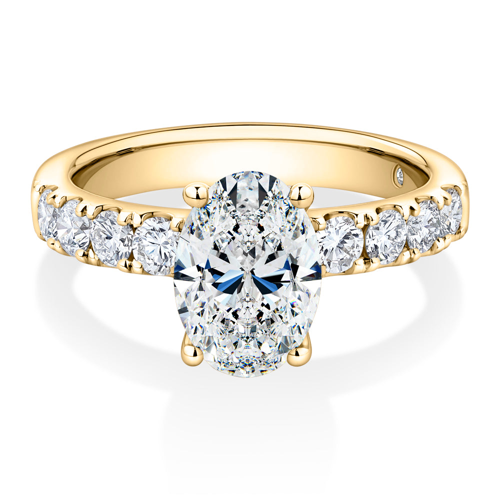Lab-Grown Simulant, 2.62 carat*TW oval and round brilliant shouldered solitaire engagement ring in 10 carat yellow gold