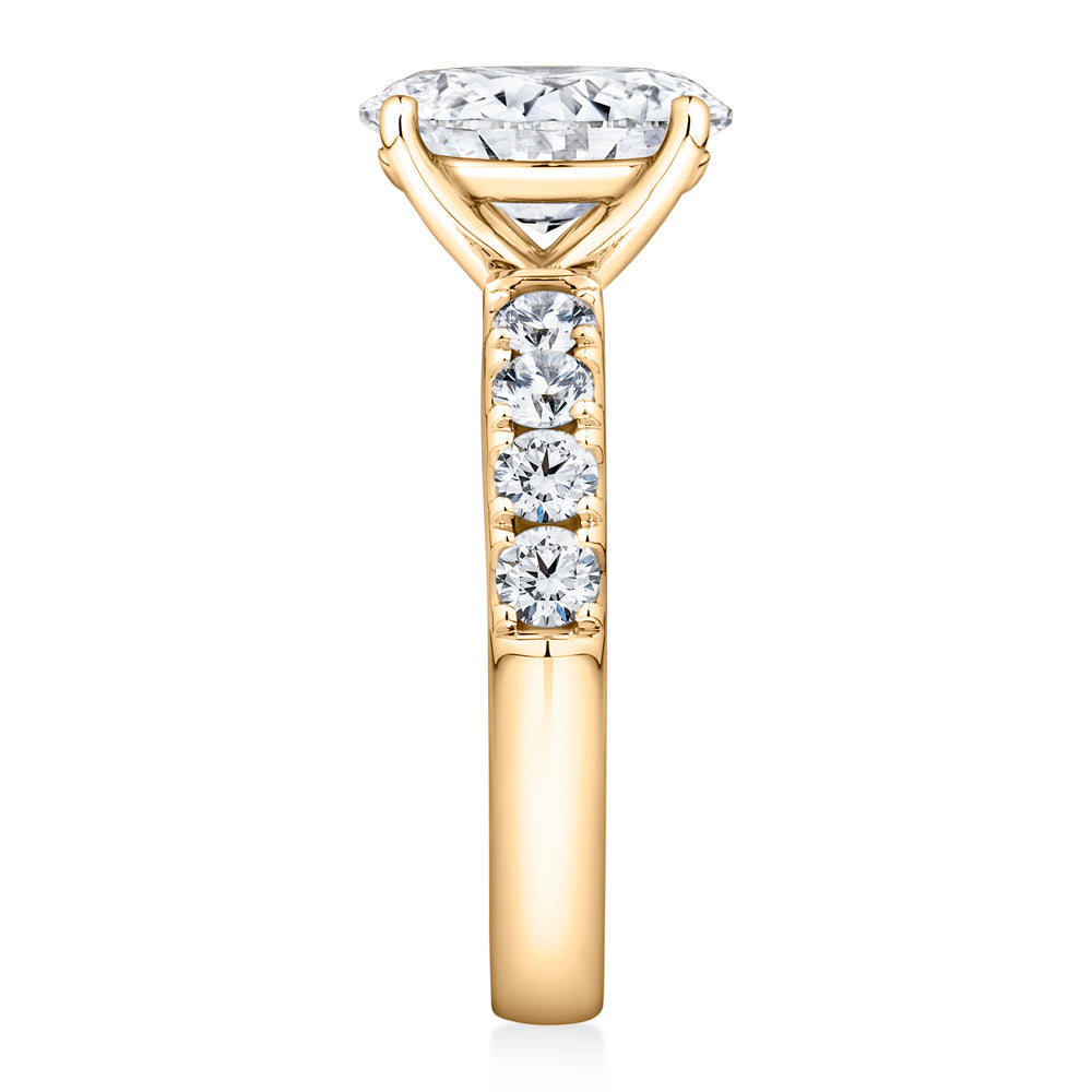 Lab-Grown Simulant, 2.62 carat*TW oval and round brilliant shouldered solitaire engagement ring in 10 carat yellow gold