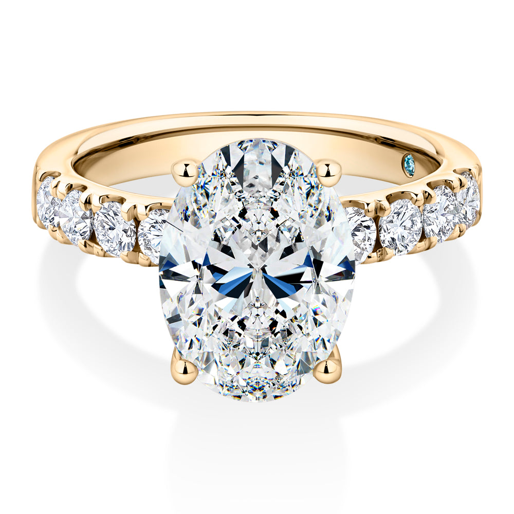 Certified Lab-Grown Diamond, 4.62 carat TW oval and round brilliant shouldered solitaire engagement ring in 14 carat yellow gold