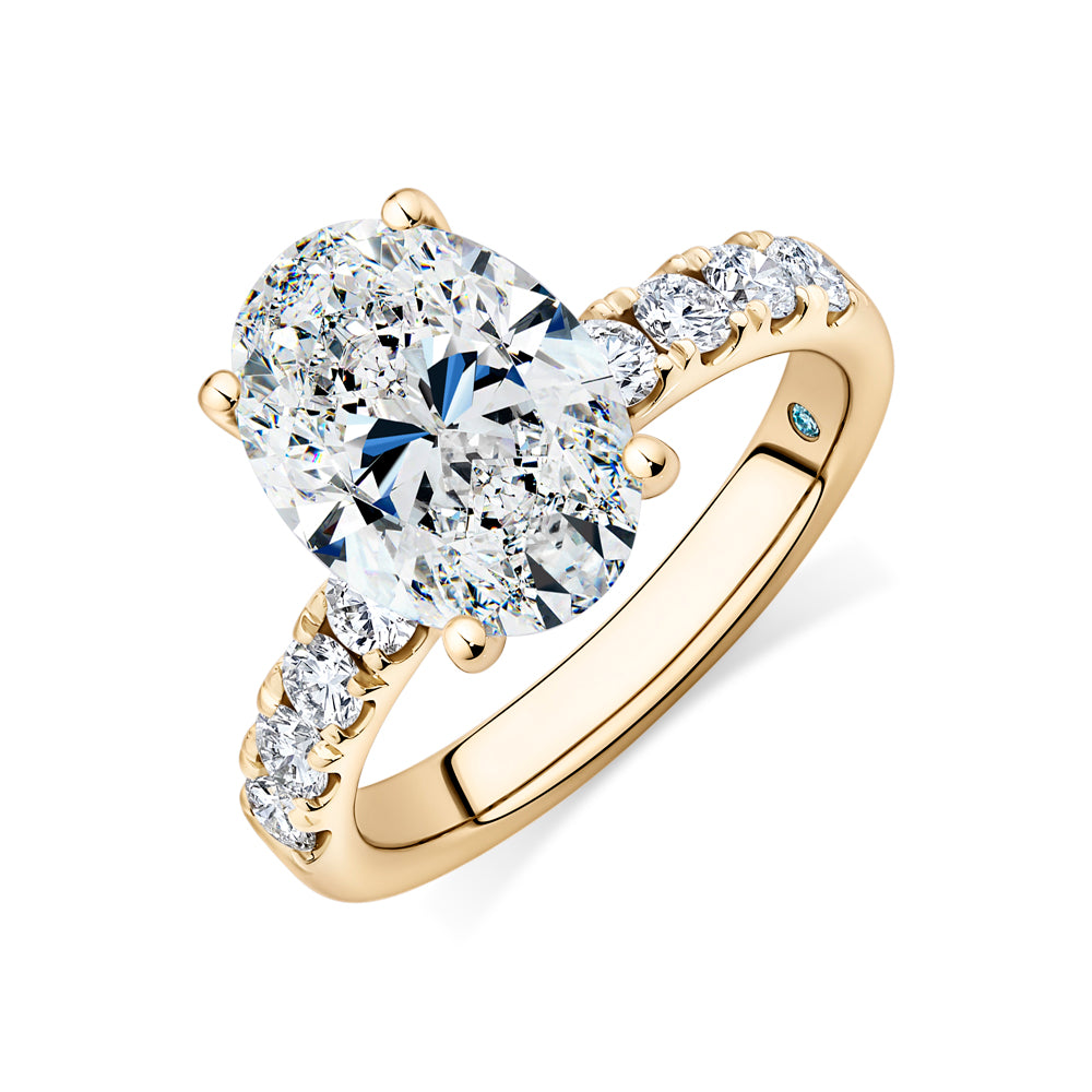 Certified Lab-Grown Diamond, 4.62 carat TW oval and round brilliant shouldered solitaire engagement ring in 14 carat yellow gold