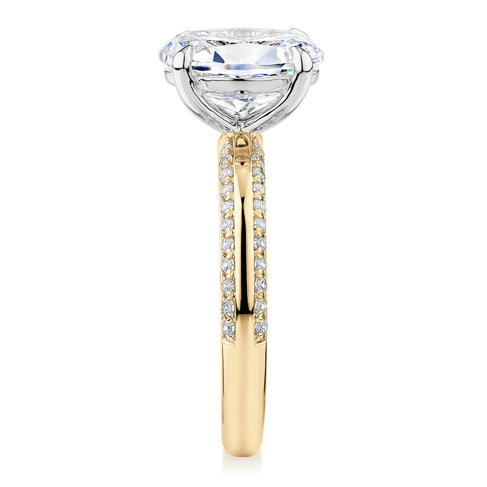 Signature Simulant Diamond 2.24 carat* TW oval cut shouldered engagement ring in 10 carat yellow and white gold