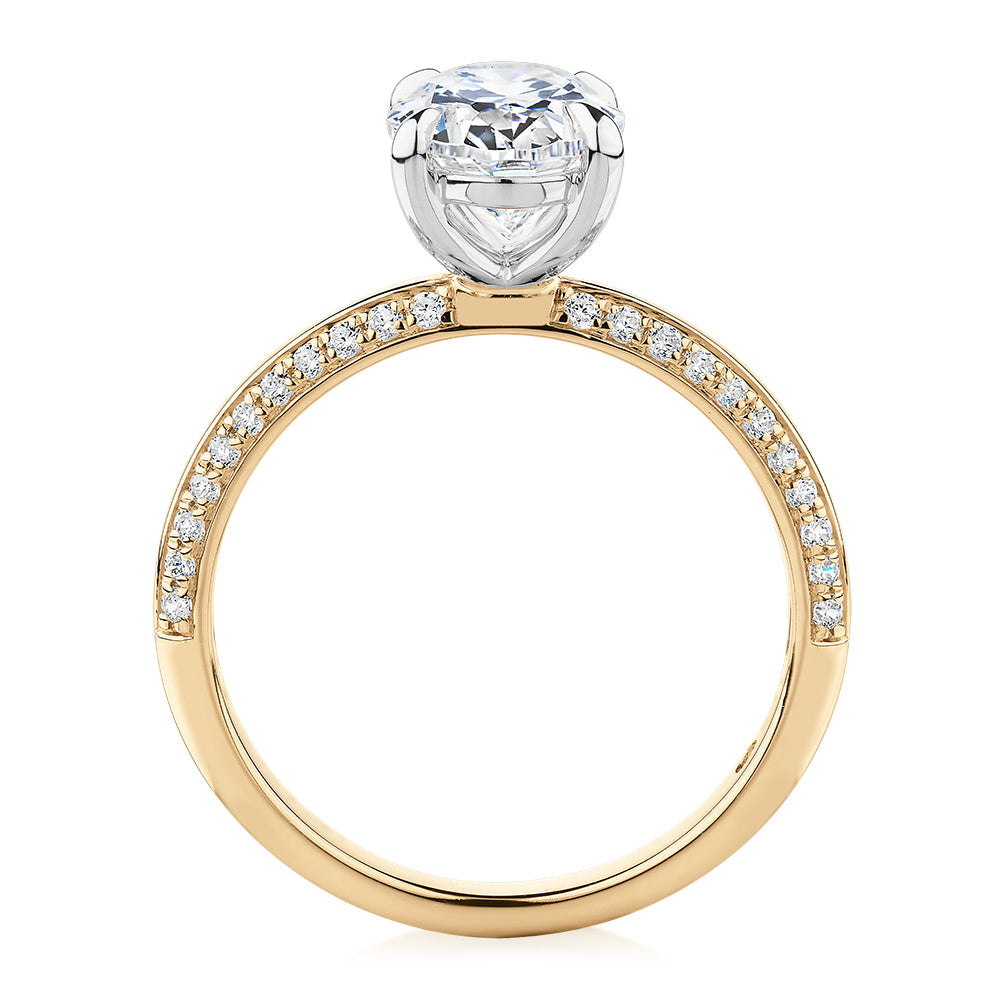 Signature Simulant Diamond 2.24 carat* TW oval cut shouldered engagement ring in 10 carat yellow and white gold