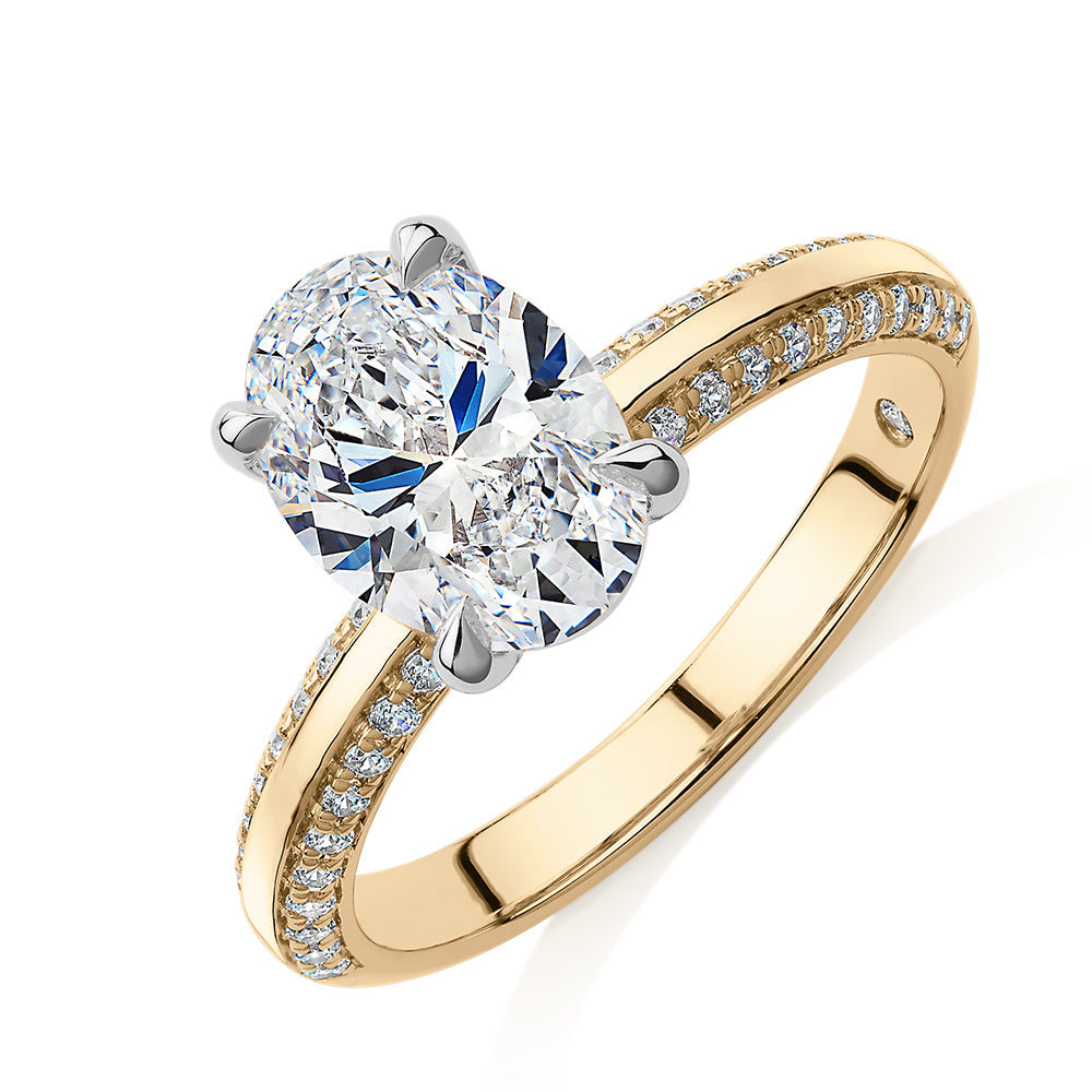 Signature Simulant Diamond 2.24 carat* TW oval cut shouldered engagement ring in 10 carat yellow and white gold