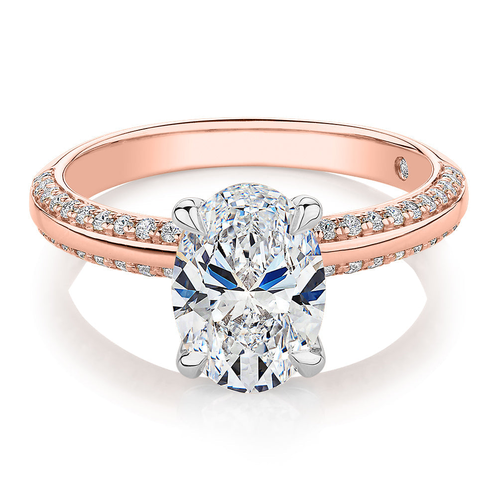 Signature Simulant Diamond 2.24 carat* TW oval cut shouldered engagement ring in 14 carat rose and white gold