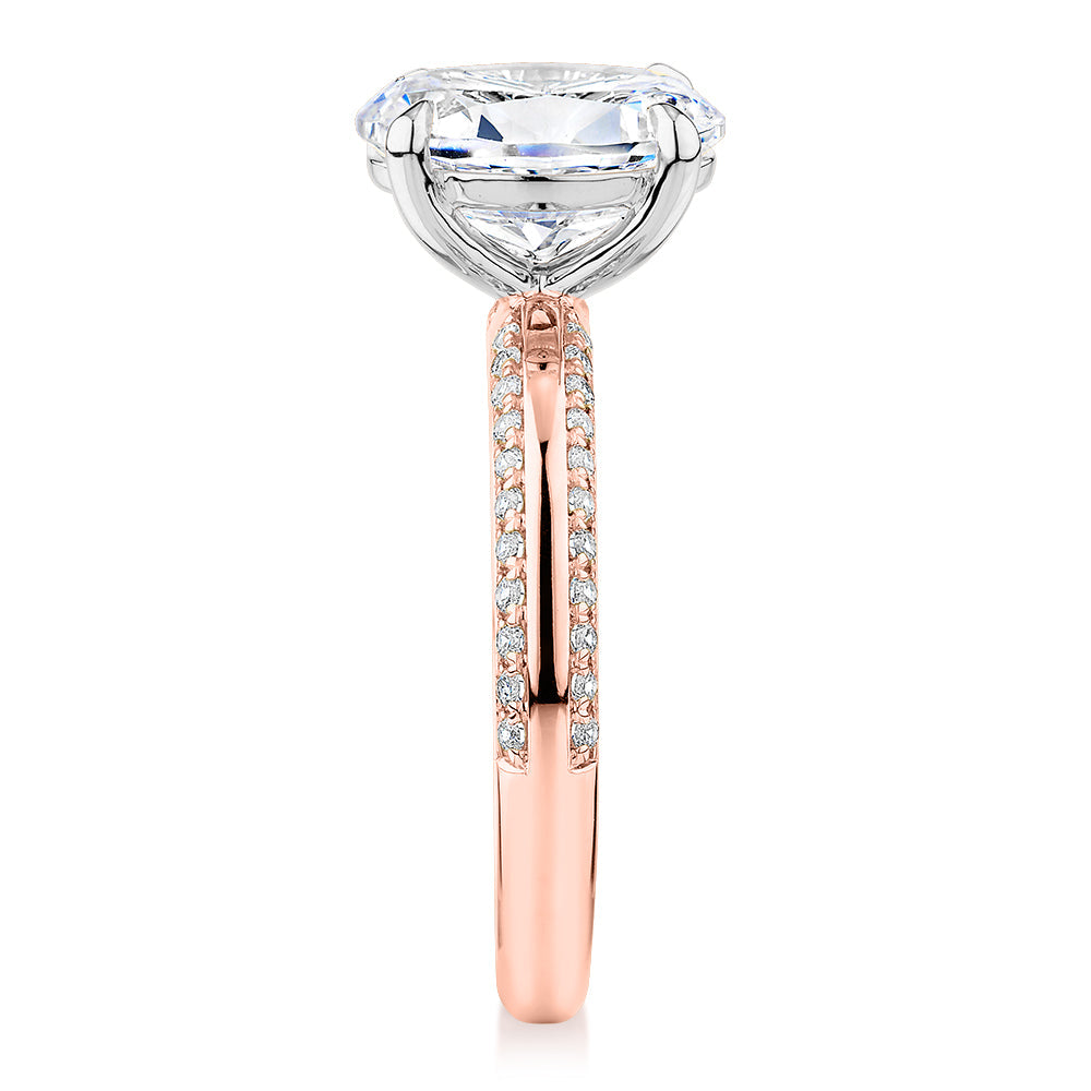 Signature Simulant Diamond 2.24 carat* TW oval cut shouldered engagement ring in 14 carat rose and white gold