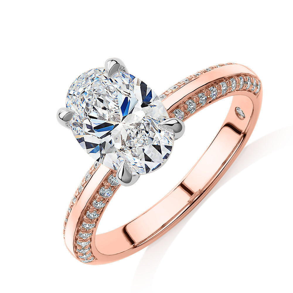 Signature Simulant Diamond 2.24 carat* TW oval cut shouldered engagement ring in 14 carat rose and white gold
